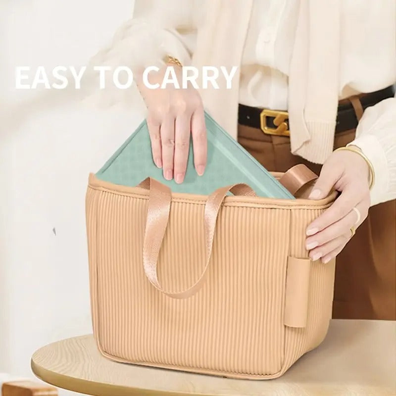 Green foldable gym mat in a stylish handbag.