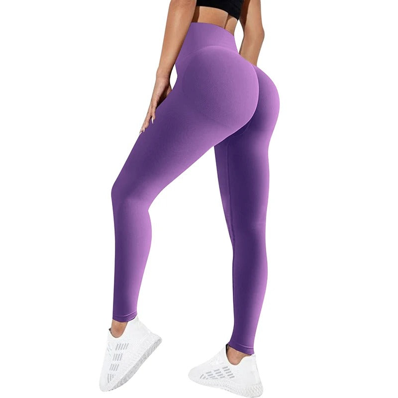 Woman wearing purple yoga pants. View from behind.