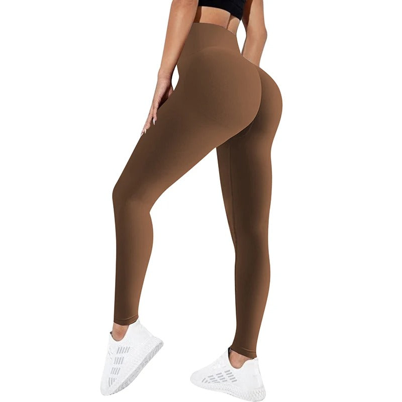 Woman wearing dark brown yoga pants. View from behind.