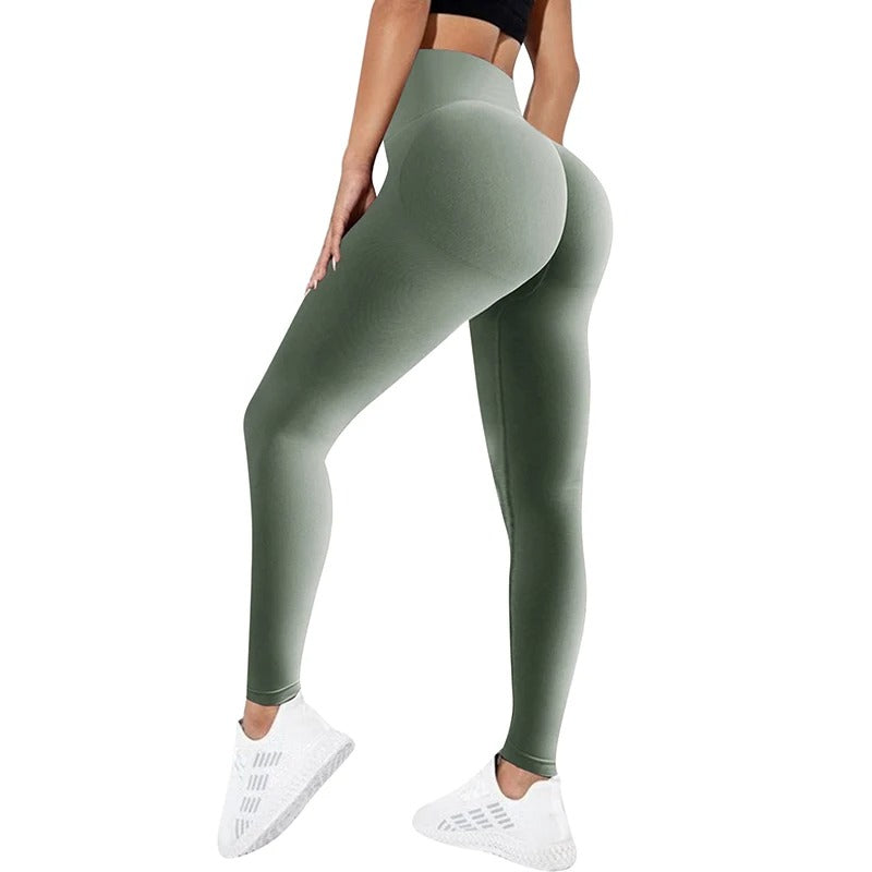 Woman wearing light green yoga pants. View from behind.