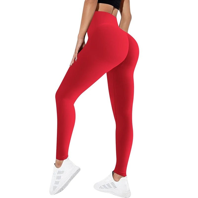 Woman wearing red yoga pants. View from behind. 
